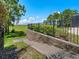 Landscaped backyard with stairs and greenery, offering serene views and outdoor enjoyment at 4951 Parkview Dr, St Cloud, FL 34771