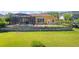 A charming backyard featuring a screened-in pool, iron fencing and beautiful lawn at 4951 Parkview Dr, St Cloud, FL 34771