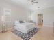 Bright bedroom featuring a neutral color palette, decorative rug, and abundant natural light at 4951 Parkview Dr, St Cloud, FL 34771