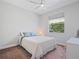 Bright bedroom with a ceiling fan, white walls, plush carpet and an outdoor view at 4951 Parkview Dr, St Cloud, FL 34771