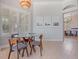 Bright breakfast nook with large window, plantation shutters, and stylish modern lighting at 4951 Parkview Dr, St Cloud, FL 34771