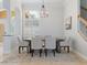 Bright dining room featuring a large table, six chairs, and elegant chandelier lighting at 4951 Parkview Dr, St Cloud, FL 34771