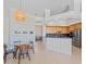 Open kitchen and dining area with granite countertops and stainless steel appliances at 4951 Parkview Dr, St Cloud, FL 34771