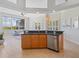 Open concept kitchen with stainless steel appliances and bar seating at 4951 Parkview Dr, St Cloud, FL 34771