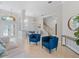 Spacious living area with tile flooring, neutral decor, and a view of the entry at 4951 Parkview Dr, St Cloud, FL 34771