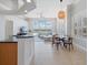 Open concept living space featuring tile floors, a living room and breakfast nook with views at 4951 Parkview Dr, St Cloud, FL 34771