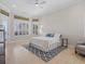 Bright main bedroom with a ceiling fan, tile floors, and a large window with outdoor views at 4951 Parkview Dr, St Cloud, FL 34771