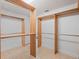 Custom walk-in closet with wood shelving and built-in organization system at 4951 Parkview Dr, St Cloud, FL 34771