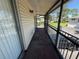 Private outdoor balcony with metal railing overlooking the community at 5564 Slash Pine Ct # 4, Orlando, FL 32811