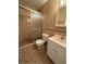 Cozy bathroom featuring a shower with sliding glass doors, toilet, and vanity with sink at 5564 Slash Pine Ct # 4, Orlando, FL 32811