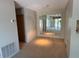 Open dining area with modern lighting and a large decorative mirror, reflecting the outdoor scenery at 5564 Slash Pine Ct # 4, Orlando, FL 32811