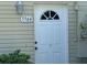 Close-up of the unit's front door with visible address number and entry lantern at 5564 Slash Pine Ct # 4, Orlando, FL 32811