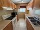 Functional kitchen space equipped with essential appliances and ample cabinet storage at 5564 Slash Pine Ct # 4, Orlando, FL 32811