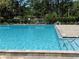 Sparkling community pool with plenty of space for swimming and relaxing in the Florida sun at 5564 Slash Pine Ct # 4, Orlando, FL 32811