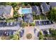 Aerial shot displaying the community's central features: pool, landscaping, buildings, and parking at 6029 Westgate Dr # 726, Orlando, FL 32835