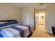 Comfortable bedroom featuring neutral tones, a plush bed, and an ensuite bathroom at 6029 Westgate Dr # 726, Orlando, FL 32835