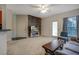 Well-lit living room with hardwood accent wall, a door to the outside, and comfortable seating at 6029 Westgate Dr # 726, Orlando, FL 32835