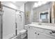 Clean bathroom featuring tile shower, white toilet and quartz countertop at 640 Bayern Ln, Debary, FL 32713
