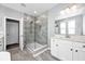 Modern bathroom features a glass-enclosed shower with gray tile and a white vanity at 640 Bayern Ln, Debary, FL 32713