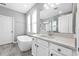Bathroom features a soaking tub, gray floors, and a white vanity with a large mirror at 640 Bayern Ln, Debary, FL 32713