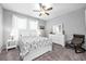 Bright bedroom with neutral walls, fan, large bed and white furniture at 640 Bayern Ln, Debary, FL 32713