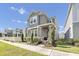 Beautiful two-story home with manicured lawn, inviting porch, and gray painted exterior at 640 Bayern Ln, Debary, FL 32713
