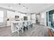 Modern eat-in kitchen featuring stainless steel appliances, large island and hardwood floors at 640 Bayern Ln, Debary, FL 32713