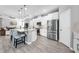 Modern eat-in kitchen featuring stainless steel appliances, large island and hardwood floors at 640 Bayern Ln, Debary, FL 32713