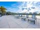 Community pool deck with lounge chairs and tables overlooking the water at 640 Bayern Ln, Debary, FL 32713