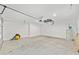 Spacious two-car garage with concrete floor and water heater at 654 Ne 130Th Ct, Silver Springs, FL 34488