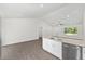 Modern kitchen with granite countertops, stainless steel appliances, and a breakfast bar at 654 Ne 130Th Ct, Silver Springs, FL 34488