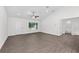 Open-concept living room with wood-look floors, recessed lights, and an en suite bathroom at 654 Ne 130Th Ct, Silver Springs, FL 34488