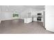 Open concept living and kitchen area, perfect for entertaining with neutral tones and modern finishes at 654 Ne 130Th Ct, Silver Springs, FL 34488
