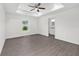 Spacious main bedroom featuring wood-look floors, recessed lighting, ceiling fan, and an en suite bathroom at 654 Ne 130Th Ct, Silver Springs, FL 34488