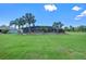 Large backyard features lush lawn and a screened pool enclosure, perfect for entertaining at 6790 Bay Shore Dr, St Cloud, FL 34771