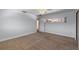 Neutral-toned carpeted bedroom with window, closet, and ceiling fan for a serene atmosphere at 6790 Bay Shore Dr, St Cloud, FL 34771