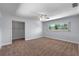 Carpeted bedroom with closet and window offering natural light, complemented by neutral wall color at 6790 Bay Shore Dr, St Cloud, FL 34771