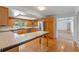 Bright kitchen boasts hardwood floors, stainless steel appliances and a breakfast bar with tile countertop at 6790 Bay Shore Dr, St Cloud, FL 34771