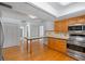 Traditional kitchen with hardwood floors, wooden cabinets, and stainless steel appliances at 6790 Bay Shore Dr, St Cloud, FL 34771