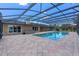 Screened pool features brick pavers and spa, enclosed for year-round enjoyment at 6790 Bay Shore Dr, St Cloud, FL 34771