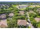 Aerial view showcasing community homes, lush greenery, and nearby school at 725 Ashworth Overlook Dr # C, Apopka, FL 32712