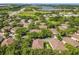 Aerial view of community homes surrounded by mature trees and close to highway at 725 Ashworth Overlook Dr # C, Apopka, FL 32712