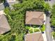 Aerial perspective of a single home featuring lush landscaping and an attractive roof, surrounded by trees and neighborhood streets at 725 Ashworth Overlook Dr # C, Apopka, FL 32712