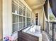 Cozy balcony with comfortable seating, perfect for enjoying the outdoors and relaxing, with views of the neighborhood at 725 Ashworth Overlook Dr # C, Apopka, FL 32712