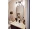 Bathroom with round sink, modern lighting, and charming decor at 725 Ashworth Overlook Dr # C, Apopka, FL 32712