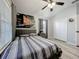 Comfortable bedroom with a large bed, closet, ceiling fan, and a gray decor providing a serene atmosphere at 725 Ashworth Overlook Dr # C, Apopka, FL 32712