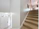 Bright foyer with a white front door, complemented by a staircase leading to the upper level at 725 Ashworth Overlook Dr # C, Apopka, FL 32712