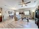Open-concept living room featuring a comfortable sectional sofa and a dining area with modern decor at 725 Ashworth Overlook Dr # C, Apopka, FL 32712