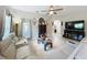 Comfortable living room with a large television, leather sofas and modern decor at 725 Ashworth Overlook Dr # C, Apopka, FL 32712