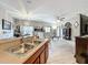 Spacious living room with bright natural light, ceiling fan, and wood-style floors at 725 Ashworth Overlook Dr # C, Apopka, FL 32712